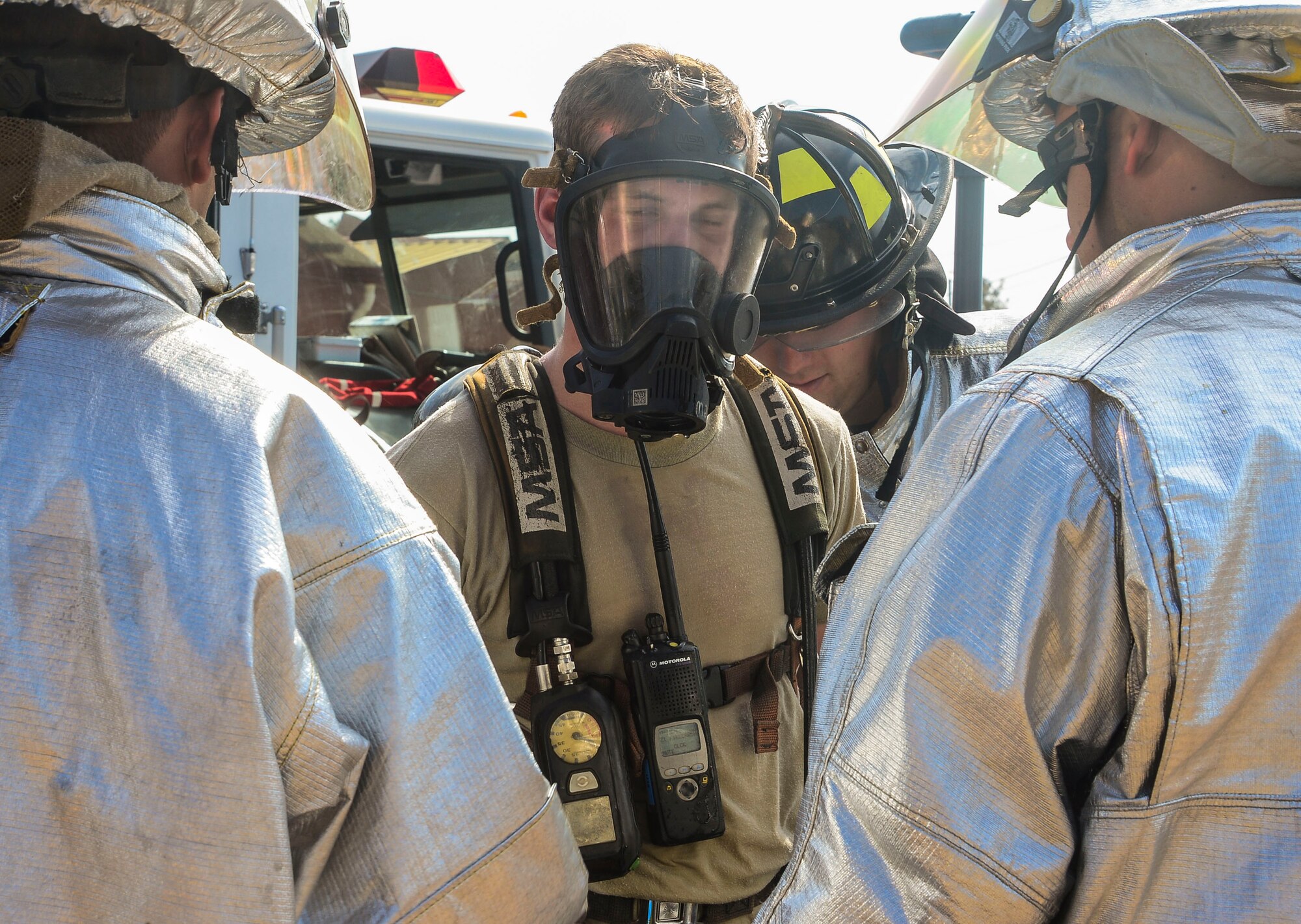 Firefighters from the 612th Air Base Squadron help U.S. Air Force Airman 1st Class Nolan Bailey, remove his contamination suit during a hazardous material exercise on Soto Cano Air Base, Honduras, Feb. 10, 2015. The training exercise was held to guarantee members assigned to the 612th ABS Fire Department are compliant with the Department of Defense’s requirement that all Air Force firefighters are certified to the hazmat technical level. (U.S. Air Force photo/Tech. Sgt. Heather Redman)