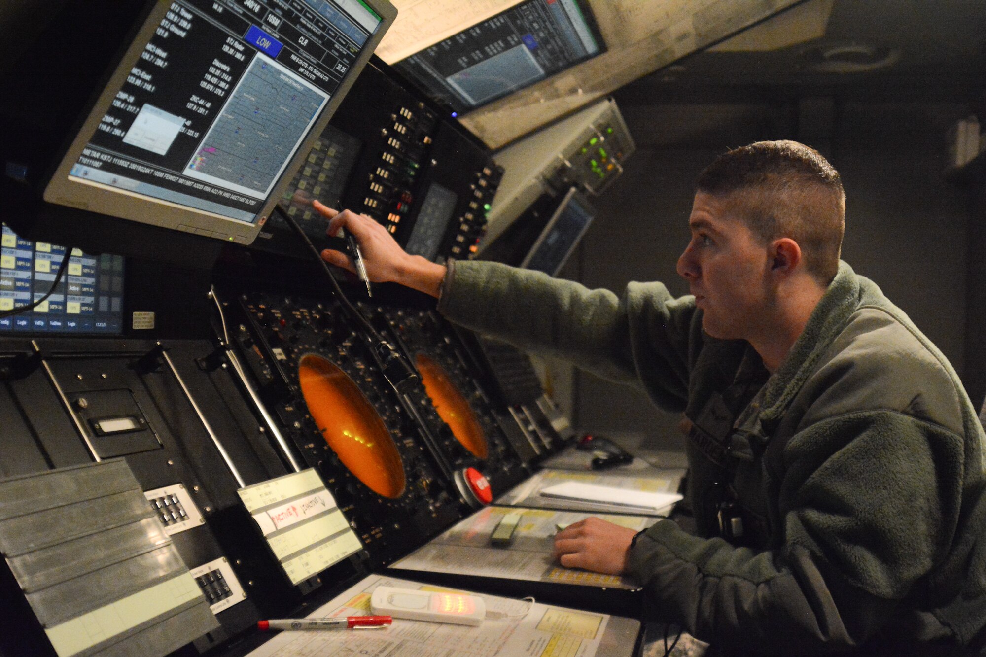 U.S. Air Force Airman 1st Class Alex Warden, an air traffic controller assigned to the 241st Air Traffic Control Squadron (ATCS), Missouri Air National Guard, monitors air traffic at Rosecrans Air National Guard Base, St. Joseph, Mo., Feb. 11, 2015. (U.S. Air National Guard photo by Tech. Sgt. Michael Crane/Released)