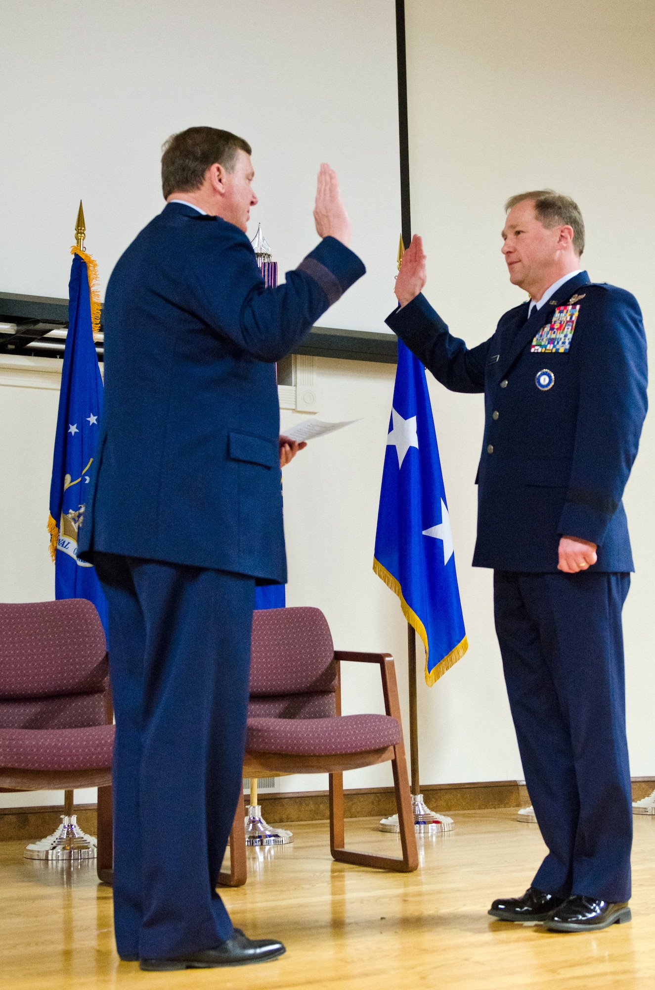 Maj. Gen. Edward W. Tonini (left), adjutant general of the Commonwealth of Kentucky, administers the oath of office to Brig. Gen. Steven P. Bullard, chief of staff for Headquarters, Kentucky Air National Guard, during a promotion ceremony for Bullard held Feb. 7, 2015, at the Kentucky Air National Guard Base in Louisville, Ky. Bullard is responsible to the assistant adjutant general for Air and to the adjutant general for coordination of policy guidance and the direction of more than 8,500 Kentucky Army and Air National Guardsmen. (U.S. Air National Guard photo by Master Sgt. Phil Speck)