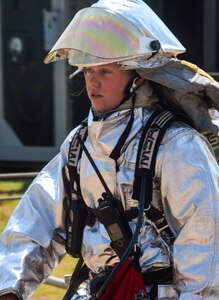 U.S. Air Force Airman 1st Class Adrianna Hopkins, 612th Air Base Squadron firefighter, helps set up a decontamination bath during a hazardous material exercise on Soto Cano Air Base, Honduras, Feb. 10, 2015. The training exercise was held to guarantee members assigned to the 612th ABS Fire Department are compliant with the Department of Defense’s requirement that all Air Force firefighters are certified to the hazmat technical level. (U.S. Air Force photo/Tech. Sgt. Heather Redman)