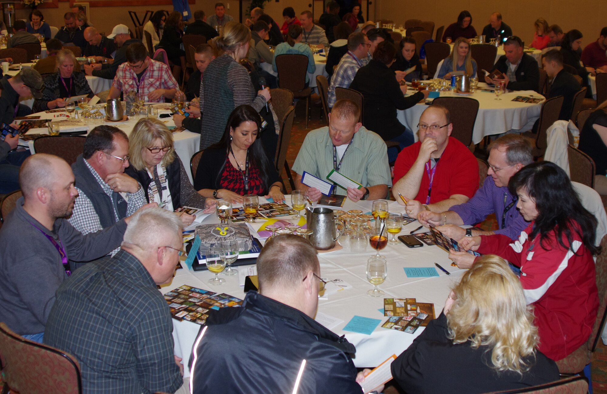 Guardsmen and their families participate in group activities during a Yellow Ribbon Reintegration Program event in Bend Ore., Jan. 24, 2015. The Yellow Ribbon Reintegration Program provides deployment support and reintegration services to all service members, and their families, enabling them to sustain the rigors associated with deployment or mobilization. (U.S. Air National Guard photos by Tech. Sgt. Aaron Perkins, 142nd Fighter Wing Public Affairs/Released)