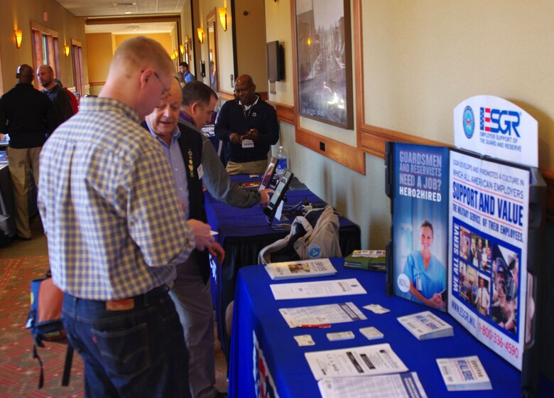 An Employer Support of the Guard and Reserve (ESGR) representative talks with a Guardsman about the organization and services provided by ESGR during a Yellow Ribbon Reintegration Program event in Bend Ore., Jan. 24, 2015. The Yellow Ribbon Reintegration Program provides deployment support and reintegration services to all service members, and their families, enabling them to sustain the rigors associated with deployment or mobilization. (U.S. Air National Guard photos by Tech. Sgt. Aaron Perkins, 142nd Fighter Wing Public Affairs/Released)