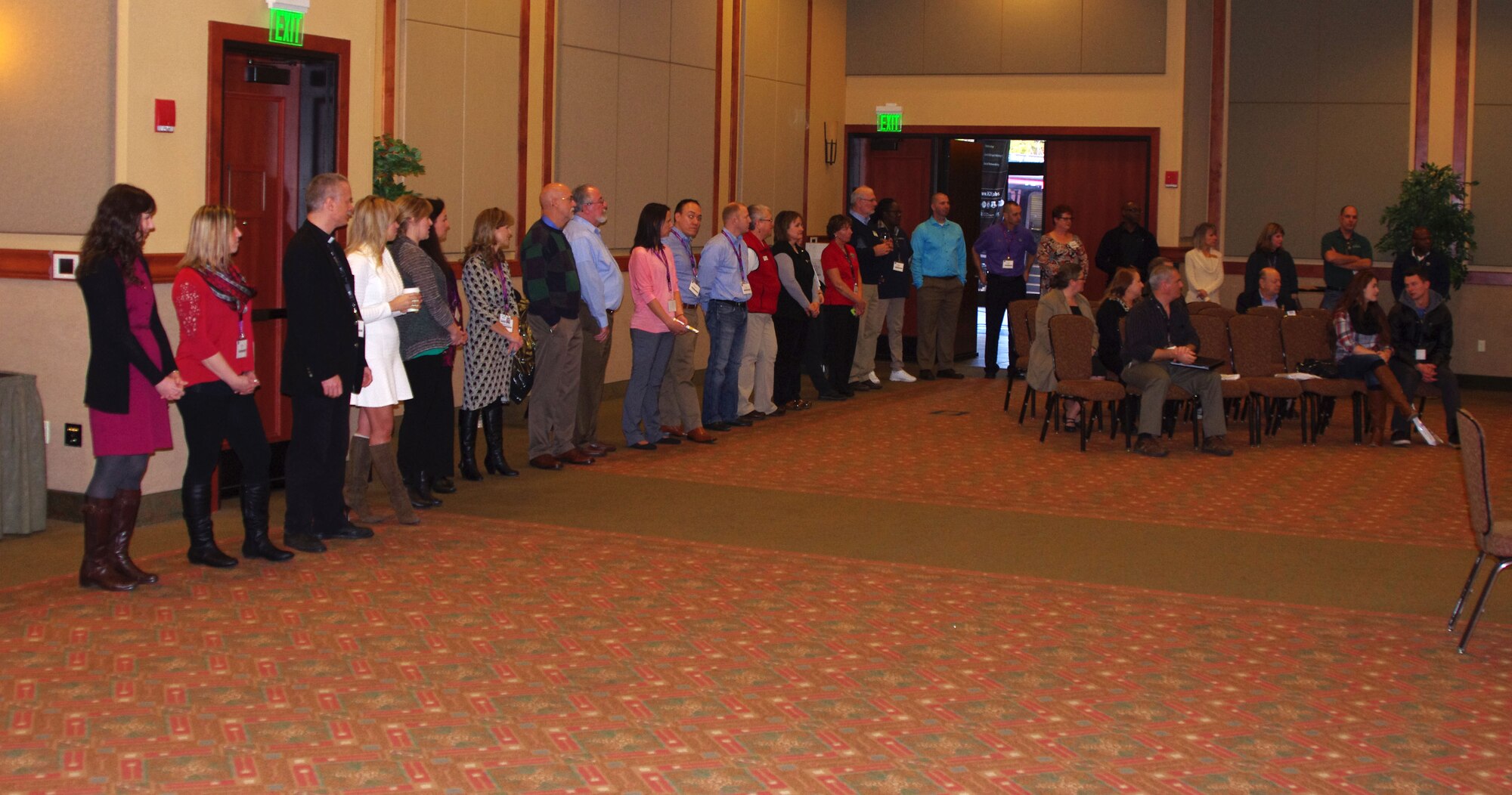 Yellow Ribbon Reintegration Program staff introduces military service providers during the introduction of a Yellow Ribbon Reintegration Program event in Bend Ore., Jan. 24, 2015. The Yellow Ribbon Reintegration Program provides deployment support and reintegration services to all service members, and their families, enabling them to sustain the rigors associated with deployment or mobilization. (U.S. Air National Guard photos by Tech. Sgt. Aaron Perkins, 142nd Fighter Wing Public Affairs/Released)