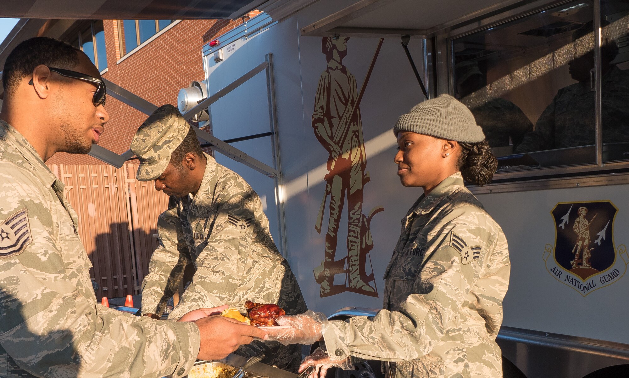 The 116th Services Flight, Georgia Air National Guard, serves a hot meal to E-8C Joint STARS aircraft maintainers during drill weekend at Robins Air Force Base, Ga., Feb. 7, 2015. The food service professionals from the 116th Air Control Wing took advantage of the opportunity to perform additional training on the use of their disaster relief mobile kitchen trailer (DRMKT), while providing nightshift aircraft maintenance workers the chance to enjoy a hot meal just off the flightline. The free-standing mobile kitchen, acquired by the unit just over a year ago, is designed for fast setup and teardown and can be transported aboard a C-130 Hercules aircraft. Airmen train on the DRMKT regularly to maintain readiness required to respond to a contingency situation across the Southeast United States. (U.S. Air National Guard photo by Master Sgt. Roger Parsons/Released)