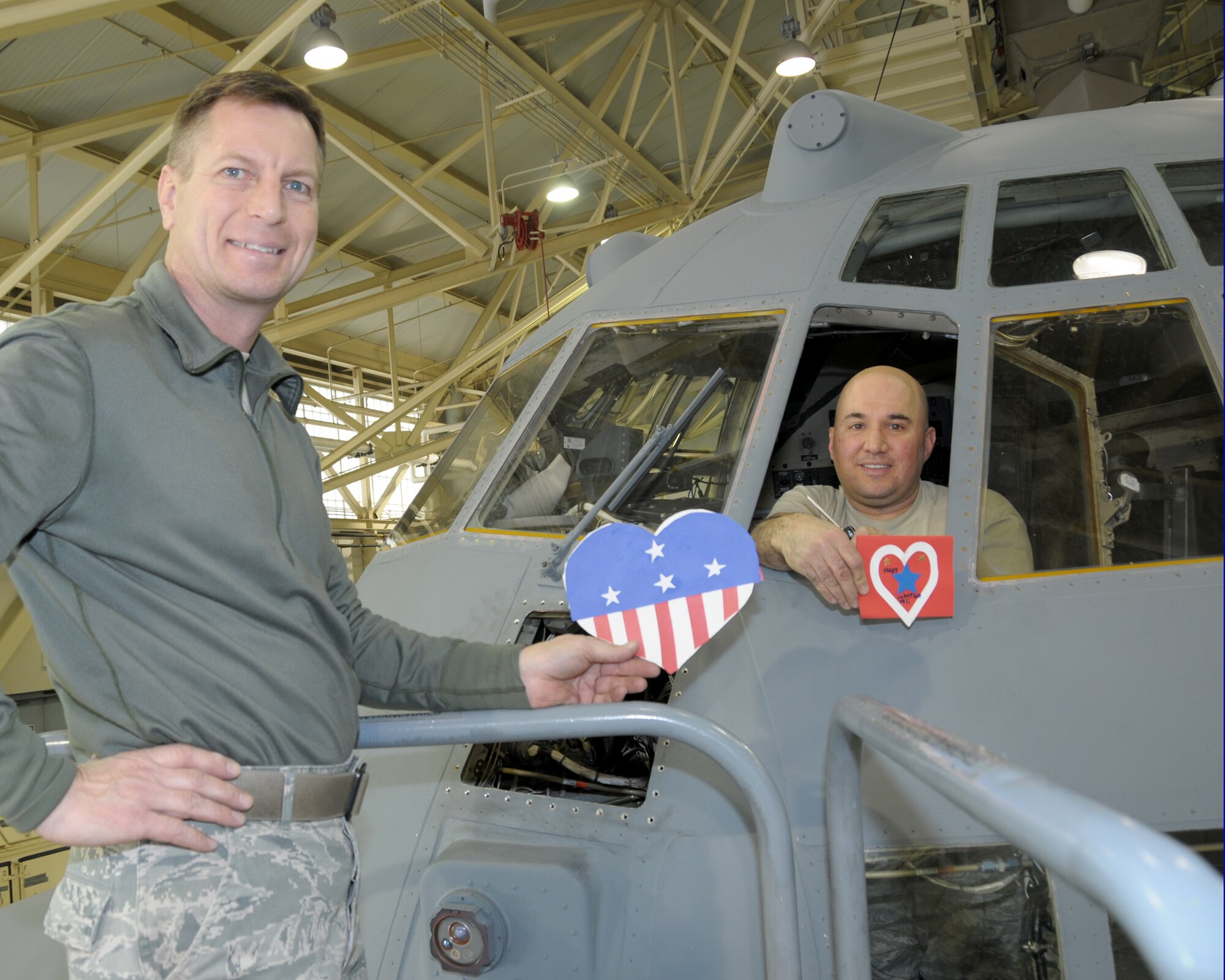 Technical Sergeants Ronald Olson (left) and Anthony Battaglia, Crew Chiefs, 914th Aircraft Maintenance Squadron display their custom made valentine cards at the Niagara Falls Air Reserve Station, N.Y. on February 10, 2015.  School children from various local schools in Erie County, N.Y. prepared these cards and many more with love and admiration to many local Western New York military members. (U.S. Air Force photo by Peter Borys) 
