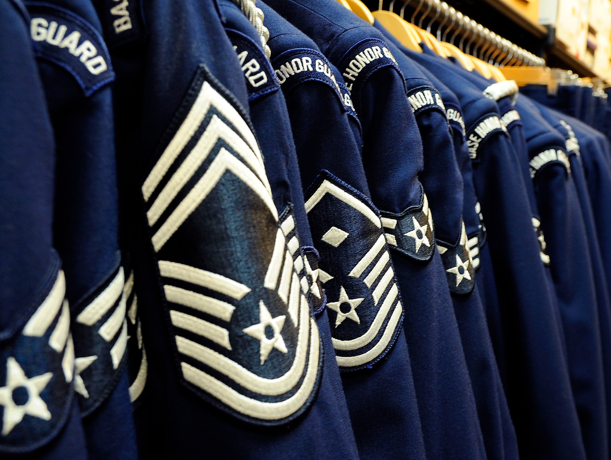 Malmstrom Air Force Base Honor Guard uniforms hang in a uniform closet. Uniforms are issued to honor guardsmen on the first day the members start their contract. The trainers and more experiences honor guardsmen help the new members prepare their ceremonial uniforms. (U.S. Air Force photo/Staff Sgt. Delia Marchick)