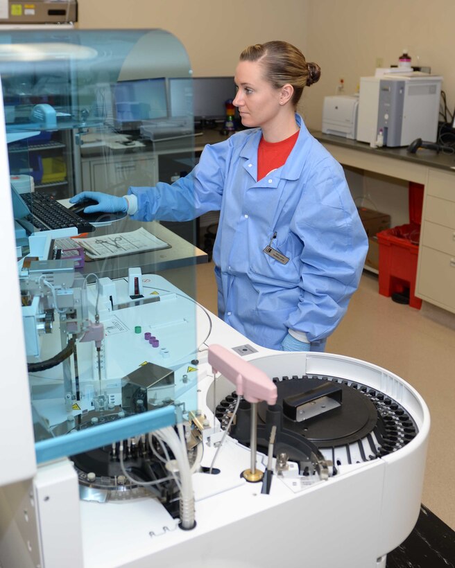 Senior Airman Brittney Harrell-Dye, 28th Medical Support Squadron laboratory technician, who supports the Biomedical Science Corps, uses a chemistry analyzer in the clinic at Ellsworth Air Force Base, S.D., Jan. 30, 2015. The BSC is a group of medical providers who enhance Air Force combat capability and effectiveness by providing world-class customer service and scientific expertise, resulting in peak force performance, productivity, and quality healthcare to beneficiaries. (U.S. Air Force photo by Rebecca Imwalle/Released) 