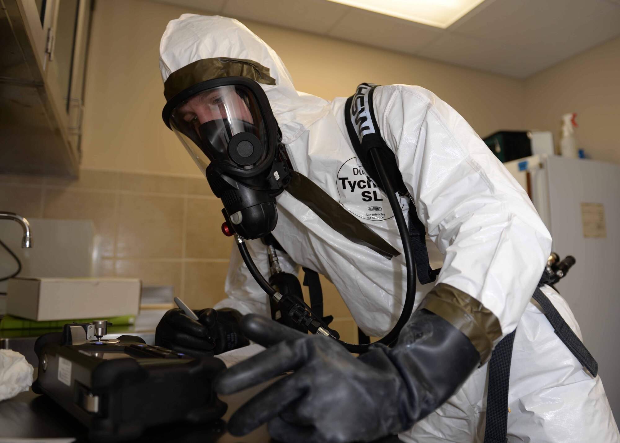 Airman 1st Class Jordan Loveless, 28th Medical Operations Squadron bioenvironmental engineering technician, uses a HazMat ID Elite machine during an unknown chemical emergency response exercise at Ellsworth Air Force Base, S.D., Jan. 30, 2015. Bioenvironmental Engineers exercise capabilities to ensure they can respond to emergencies such as aircraft crashes, hazardous materials and chemical, biological, radiological, nuclear and explosives emergencies. (U.S. Air Force photo by Rebecca Imwalle/Released)