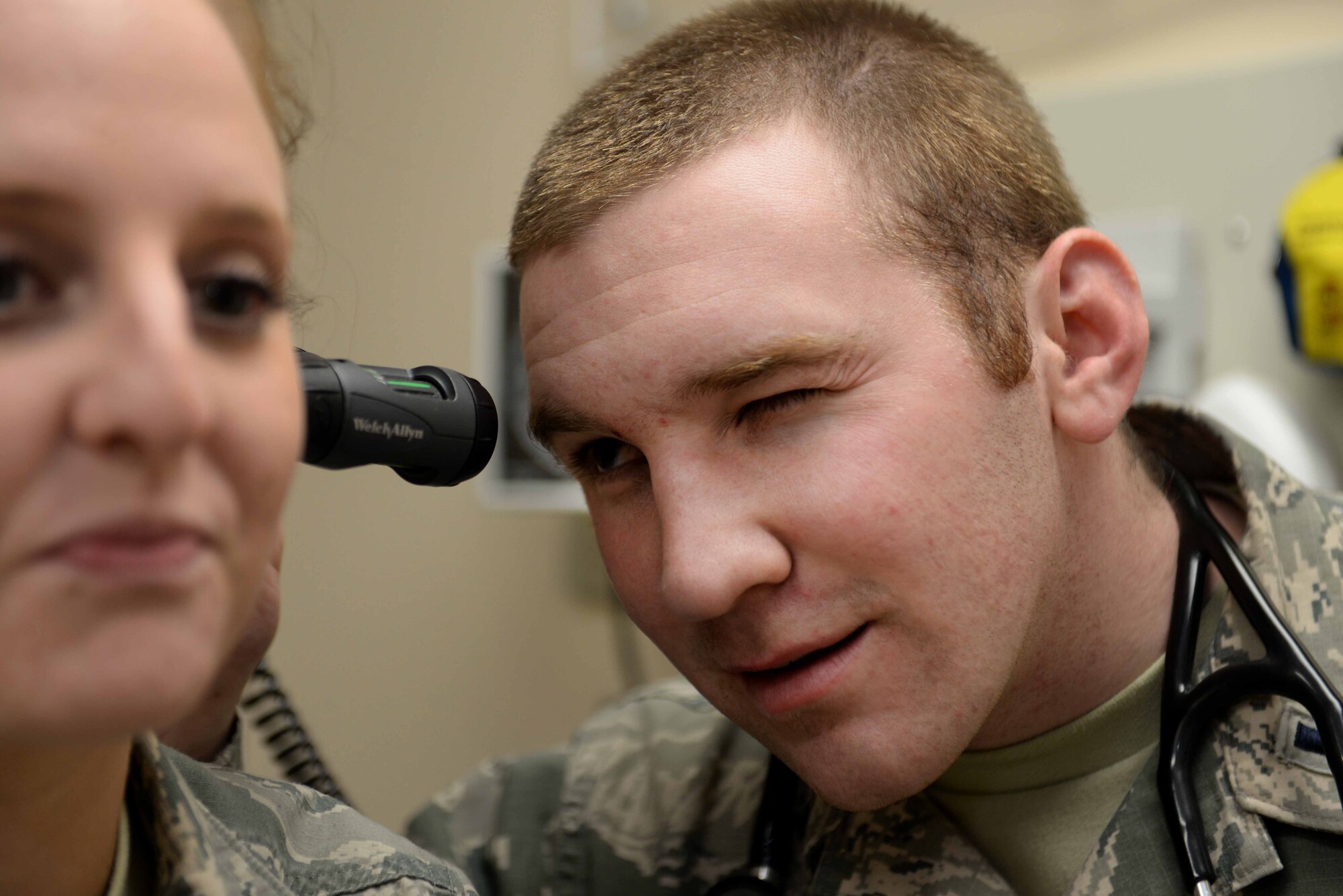 First Lt. Jesse Gronsky, 28th Medical Operations Squadron physician assistant and Biomedical Science Corps member, uses an otoscope to perform an ear examination on Airman 1st Class Alexandra Hill, 28th Medical Support Squadron unit deployment manager, at Ellsworth Air Force Base, S.D. The BSC is a diverse group of medical providers who celebrated its 50th anniversary during this year’s BSC Appreciation Week Jan. 26 to 30. (U.S. Air Force photo by Airman 1st Class Rebecca Imwalle/ Released)