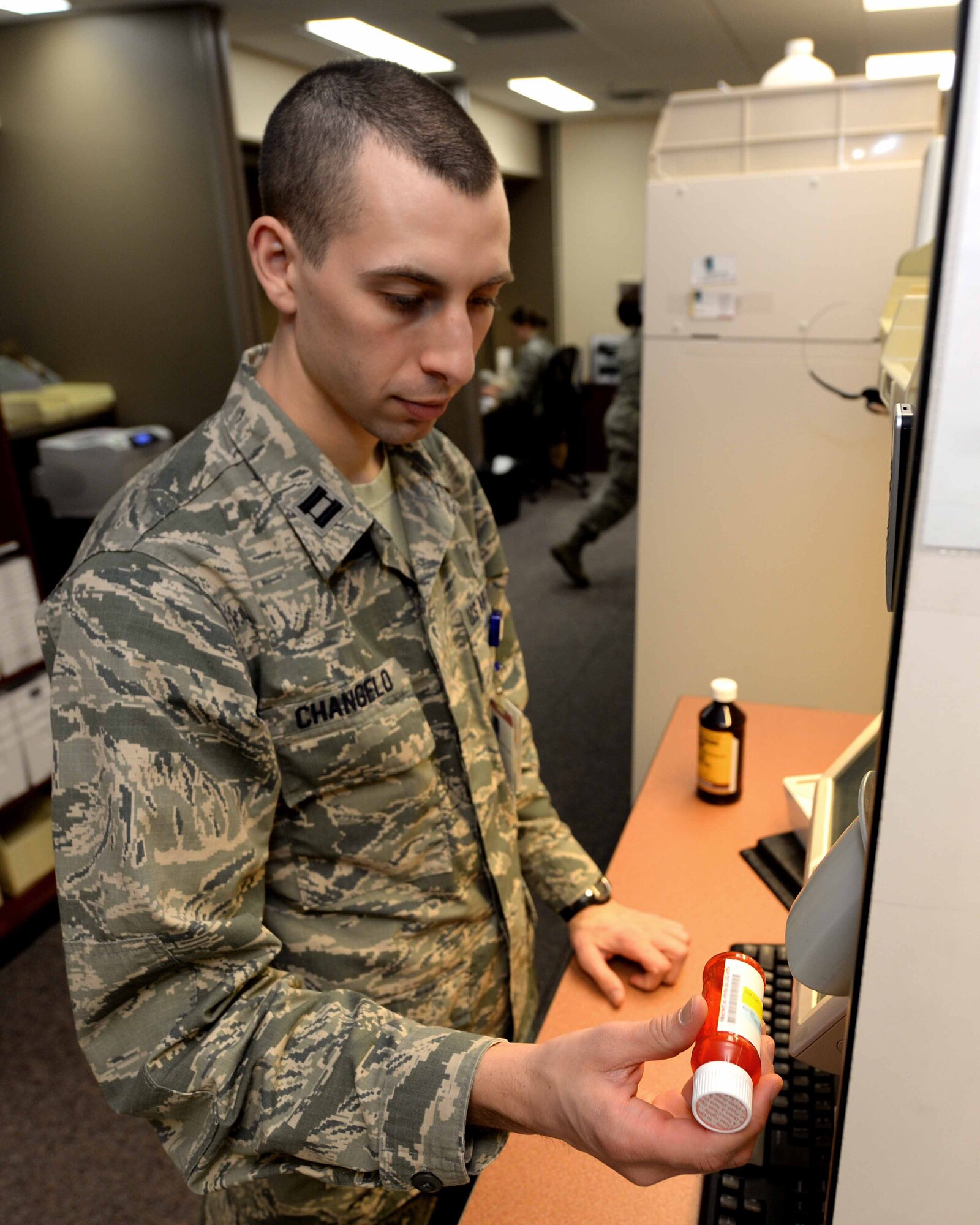 Capt. Anthony Changelo, 28th Medical Support Squadron pharmacy element chief and Biomedical Science Corps member, performs a quality check on a prescription at the pharmacy at Ellsworth Air Force Base, S.D., Jan. 29, 2014. The BSC is made up of a diverse group of medical professionals to include pharmacists, physical therapists and physician assistants. (U.S. Air Force photo by Airman 1st Class Rebecca Imwalle/ Released)