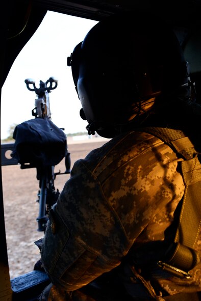 A U.S. Army National Guard soldier assigned to the 1st Battalion, 169th Aviation Regiment, Ft. Bragg, N.C., prepares to shoot a M240 machine gun at Poinsett Electronic Combat Range, Sumter, S.C., Feb. 6, 2015. One of the range’s capabilities includes microphones that detect if munitions hit their target, tallying an approximate number of hits and misses. (U.S. Air Force photo by Airman 1st Class Diana M. Cossaboom/Released)