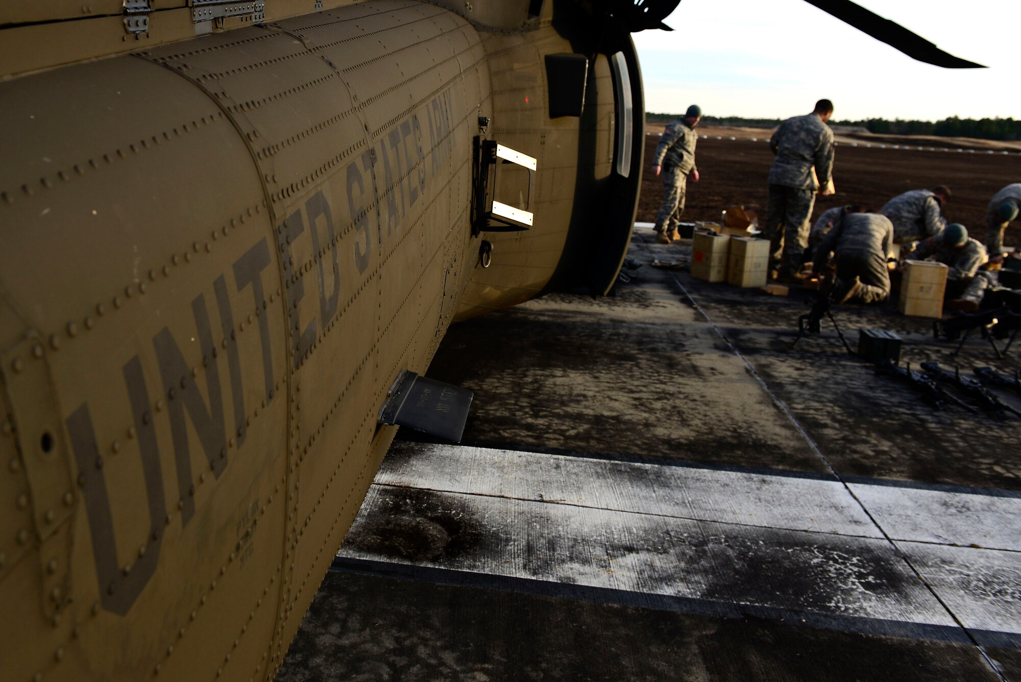 U.S. Army National Guard soldiers assigned to the 1st Battalion, 169th Aviation Regiment, Ft. Bragg, N.C., prepare bullets for M240 machine guns at Poinsett Electronic Combat Range, Sumter, S.C., Feb. 6, 2015. Some of the aircraft that utilize Poinsett include the F-16CM Fighting Falcon, F-15E Strike Eagle, F/A-18 Super Hornet, UH-60 Black Hawk, and AH-64 Apache. (U.S. Air Force photo by Airman 1st Class Diana M. Cossaboom/Released)