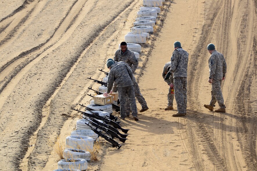 U.S. Army National Guard soldiers assigned to the 1st Battalion, 169th Aviation Regiment, Ft. Bragg, N.C., prepare to shoot M240 machine guns during training at Poinsett Electronic Combat Range, Sumter, S.C., Feb. 6, 2015. The 12,500 acre range is used for munitions training by all military services. (U.S. Air Force photo by Airman 1st Class Diana M. Cossaboom/Released)