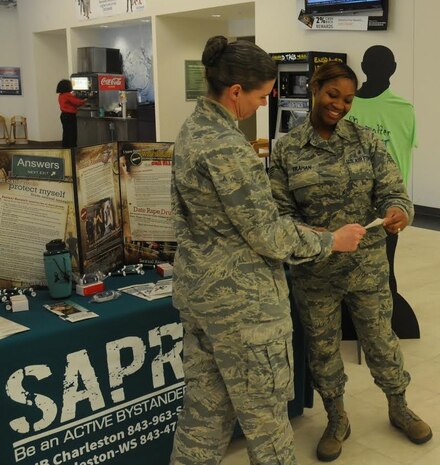 Colonel Margaret Jones, 628th Medical Group commander speaks with Staff Sgt. Lakin Trahan, 628th Medical Group during the Sexual Assault Prevention and Response Program Information Fair Jan. 28, 2015 at the Base Exchange on Joint Base Charleston, S.C. The purpose of the SAPR Information Fair was to educate people about the impact sexual assaults can have on a person and the community as a whole. In addition to being set up in the Base Exchange, there were information tables set up in the 628th MDG lobby and the Gaylor Dining Facility. (Courtesy photo)  