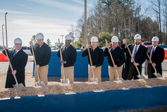 A groundbreaking ceremony for military construction projects P100/P099 was held Feb. 6, 2015 at Nuclear Power Training Unit Charleston at Joint Base Charleston – Weapons Station, S.C. Pictured (from left): Charles Friendly, Site Project Planning and Engineering manager, Master Chief Donald Ziegler, NPTU command master chief, CAPT Steve Hamer, Naval Facilities Engineering Command Southeast commanding officer, CAPT Robert Hudson, NPTU Charleston commanding officer, CAPT Timothy Sparks, JB Charleston deputy commander, J.H. Smyder, NPTU technical director and B.E. Stewart, Caddell Construction Co., Inc., president and CEO.  The NPTU building currently serves more than 1,400 students a year, and is expected to double to more than 3,000 students by 2020. The new facilities and simulation technology will enable NPTU’s mission to successfully meet the future Fleet training demand. (U.S. Air Force photo / Senior Airman Tom Brading)

