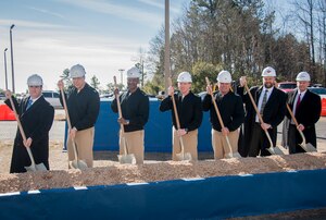 A groundbreaking ceremony for military construction projects P100/P099 was held Feb. 6, 2015 at Nuclear Power Training Unit Charleston at Joint Base Charleston – Weapons Station, S.C. Pictured (from left): Charles Friendly, Site Project Planning and Engineering manager, Master Chief Donald Ziegler, NPTU command master chief, CAPT Steve Hamer, Naval Facilities Engineering Command Southeast commanding officer, CAPT Robert Hudson, NPTU Charleston commanding officer, CAPT Timothy Sparks, JB Charleston deputy commander, J.H. Smyder, NPTU technical director and B.E. Stewart, Caddell Construction Co., Inc., president and CEO.  The NPTU building currently serves more than 1,400 students a year, and is expected to double to more than 3,000 students by 2020. The new facilities and simulation technology will enable NPTU’s mission to successfully meet the future Fleet training demand. (U.S. Air Force photo / Senior Airman Tom Brading)

