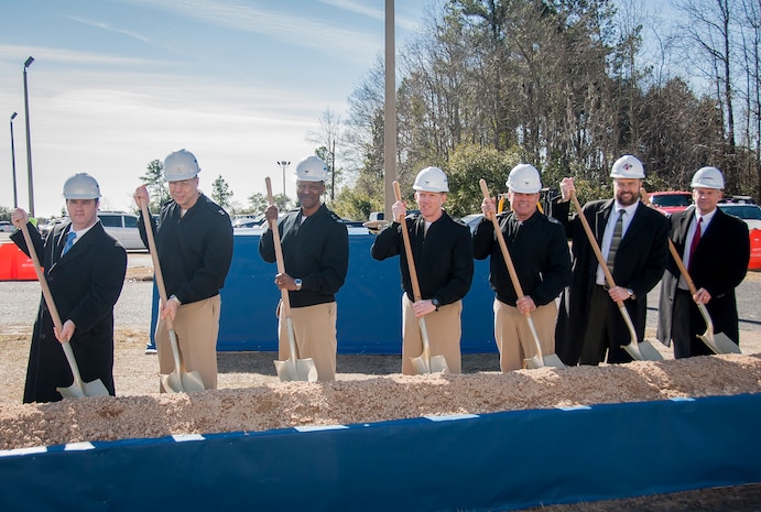 A groundbreaking ceremony for military construction projects P100/P099 was held Feb. 6, 2015 at Nuclear Power Training Unit Charleston at Joint Base Charleston – Weapons Station, S.C. Pictured (from left): Charles Friendly, Site Project Planning and Engineering manager, Master Chief Donald Ziegler, NPTU command master chief, CAPT Steve Hamer, Naval Facilities Engineering Command Southeast commanding officer, CAPT Robert Hudson, NPTU Charleston commanding officer, CAPT Timothy Sparks, JB Charleston deputy commander, J.H. Smyder, NPTU technical director and B.E. Stewart, Caddell Construction Co., Inc., president and CEO.  The NPTU building currently serves more than 1,400 students a year, and is expected to double to more than 3,000 students by 2020. The new facilities and simulation technology will enable NPTU’s mission to successfully meet the future Fleet training demand. (U.S. Air Force photo / Senior Airman Tom Brading)

