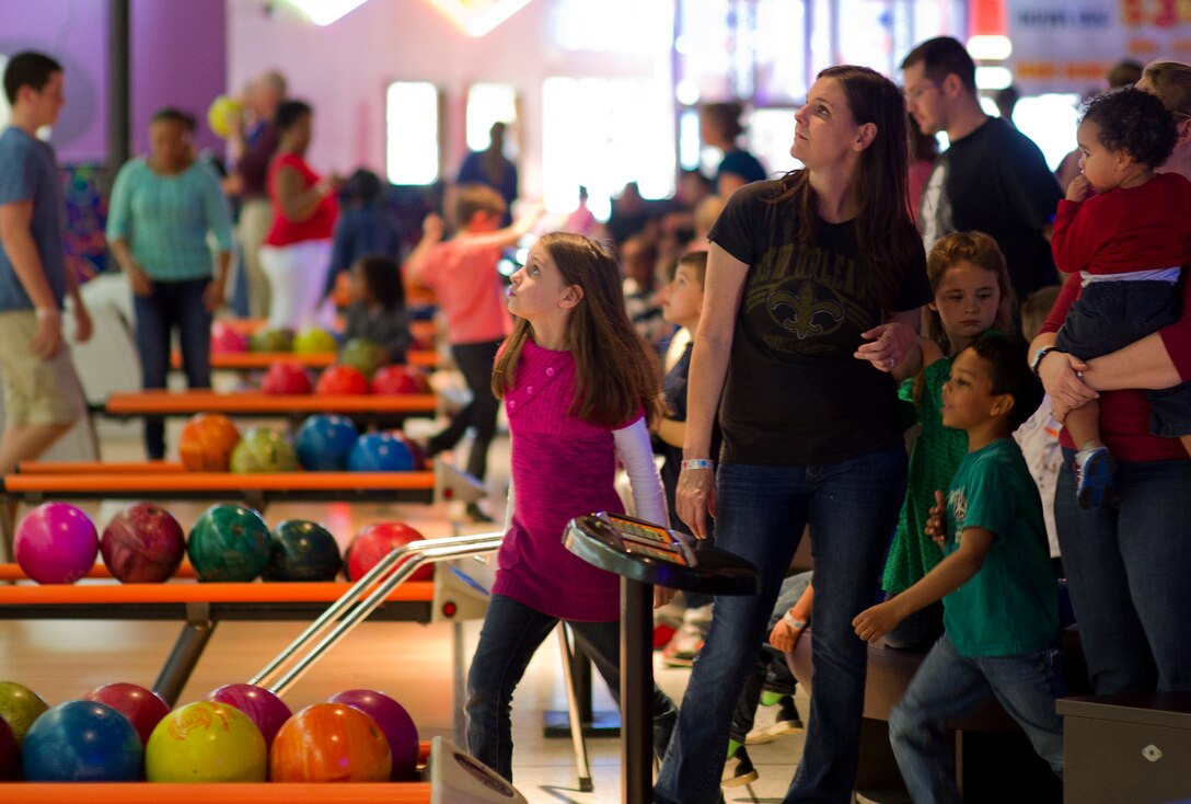 Family members of deployed or remote Airmen enjoy free bowling Feb. 8 at Rock’It Lanes during a Hearts Apart party funded by the Bay County Chamber of Commerce Military Affairs Committee. This event helped strengthen military and community relationships as well as provided support for these families through stressful times. (U.S. Air Force photo by Senior Airman Alex Echols/Released)