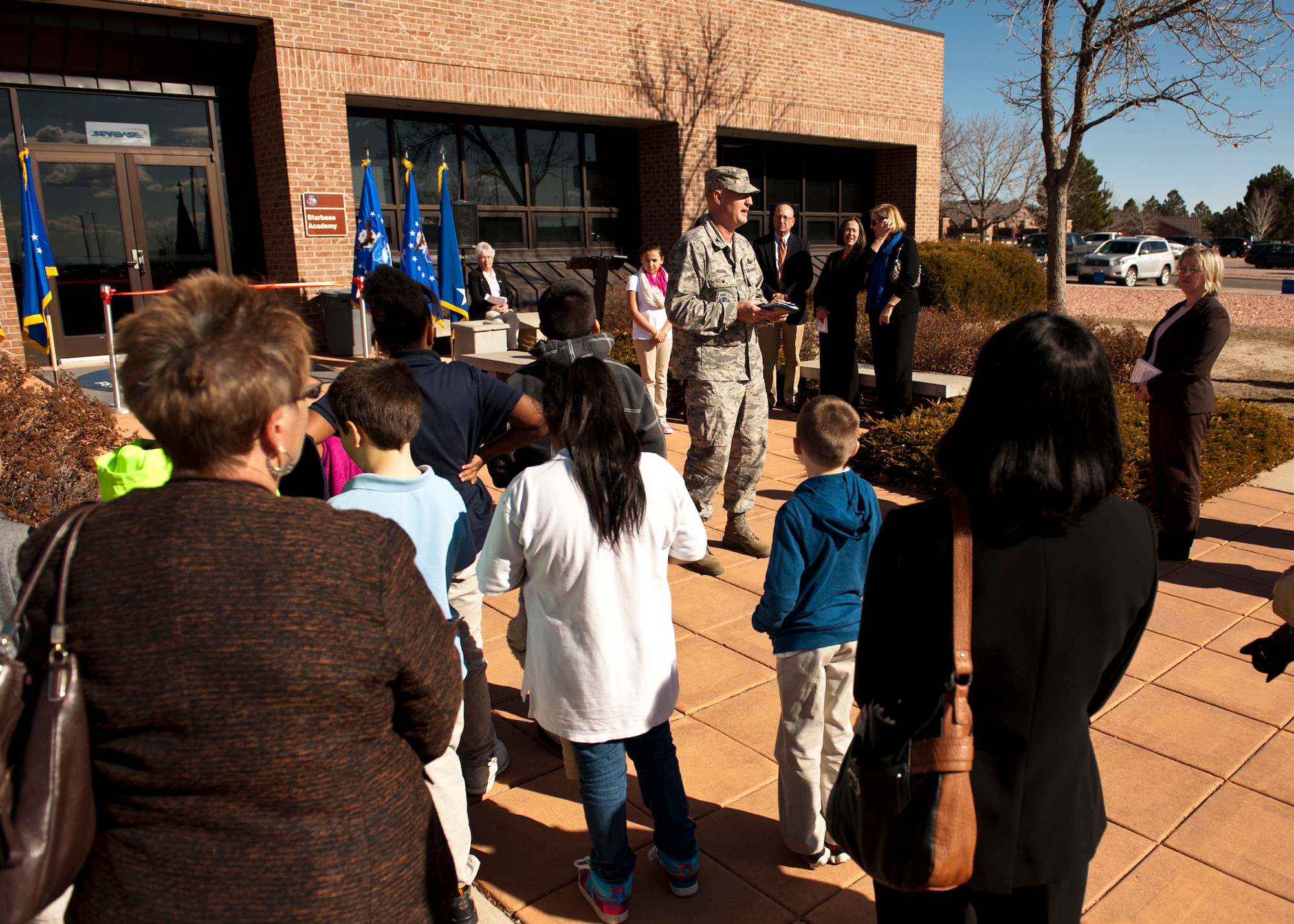 PETERSON AIR FORCE BASE, Colo. – Col. Michael Hough, 21st Space Wing vice commander, welcomes attendees to the STARBASE facility ribbon cutting ceremony Feb. 2, 2015. After years in the making, the facility will host 25-50 fifth grade students from local elementary schools for five-day programs, where they will learn various lessons in science, technology, engineering and mathematics. (U.S. Air Force photo by Senior Airman Tiffany DeNault)