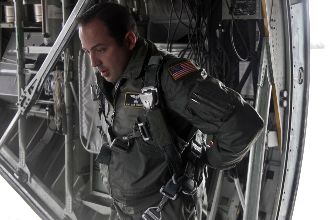 Master Sgt. John Cellurale, a loadmaster 911th Operations Group, checks his safety harness during a pre-flight inspection at the Pittsburgh International Airport Air Reserve Station, February 8, 2015. Cellurale inspected the harness in preparation for a containerized delivery system air drop.  (U.S. Air Force photo by Staff Sgt. Jonathan Hehnly)