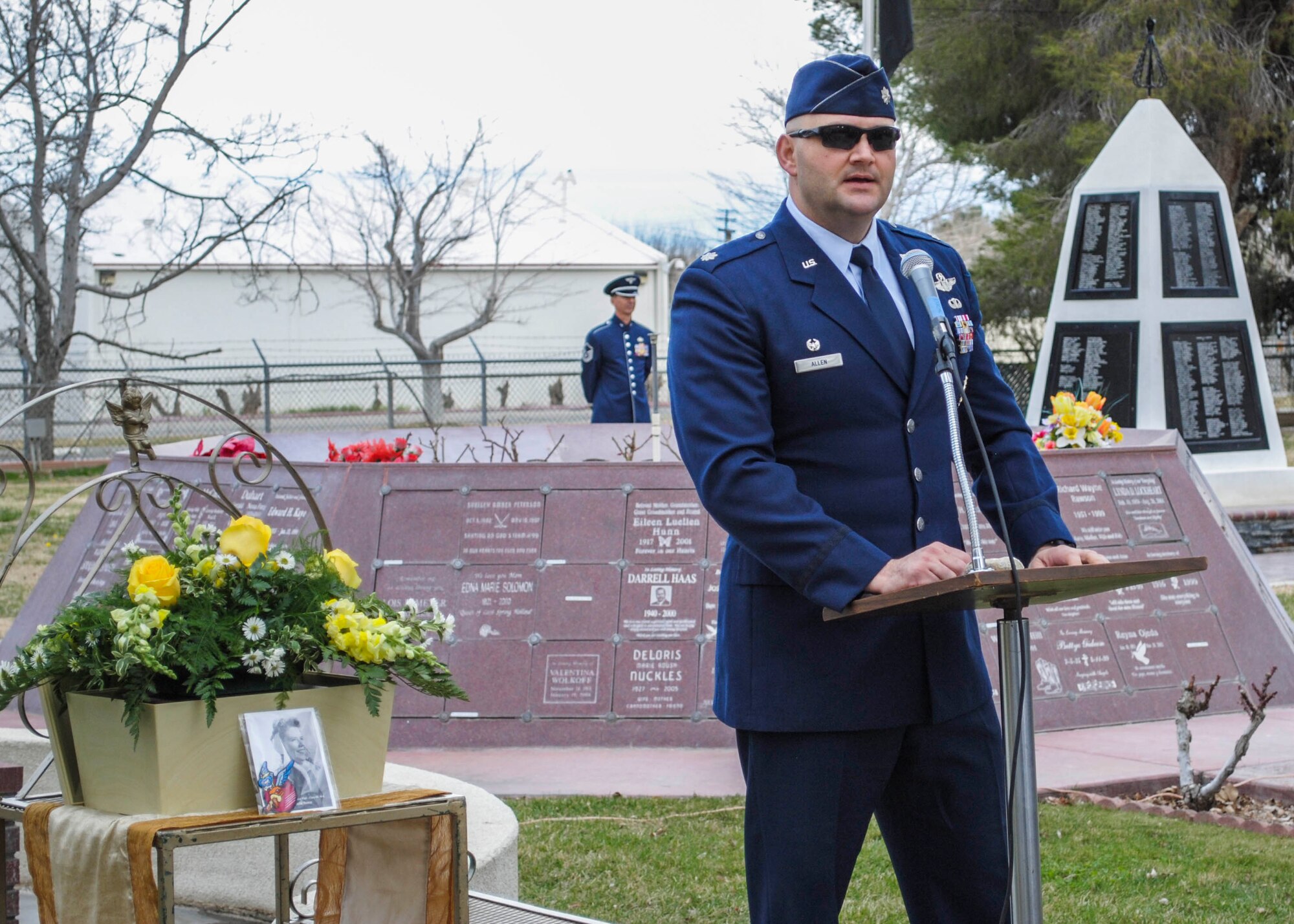 Lt. Col. Andrew Allen, 461st Flight Test Squadron commander, shared his memories of WASP Flora Belle Reece, standing in front of the Military Court of Honor at the Lancaster Cemetery Feb. 7. (U.S. Air Force photo by Rebecca Amber)