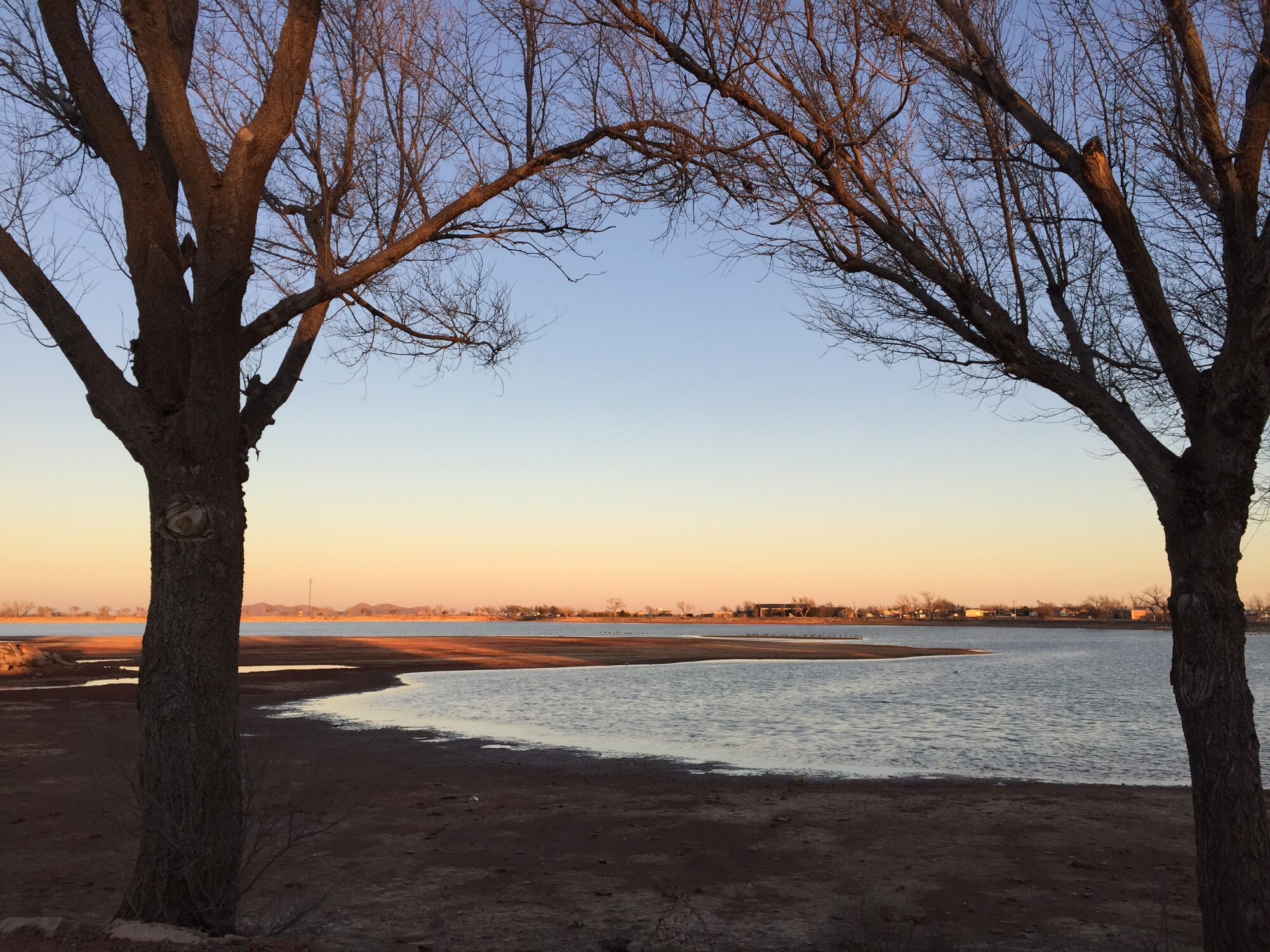 ALTUS, Okla. – The sun sets on the City of Altus reservoir Feb. 9, 2015. Due to a long-lasting drought in the local region, the water level of the city’s reservoir has decreased. Altus Air Force Base and the City of Altus are coordinating to improve water quality and increase the supply of water to residents before 2016. (U.S. Air Force photo by Staff Sgt. Nathanael Callon/Released)