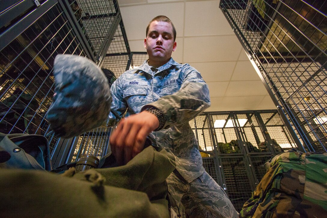 Staff Sgt. Dante Rosini, 108th Civil Engineer Squadron, checks his mobility bag at the 108th Wing, New Jersey Air National Guard at Joint Base McGuire-Dix-Lakehurst, N.J., Feb. 7, 2015. (U.S. Air National Guard photo by Master Sgt. Mark C. Olsen/Released)