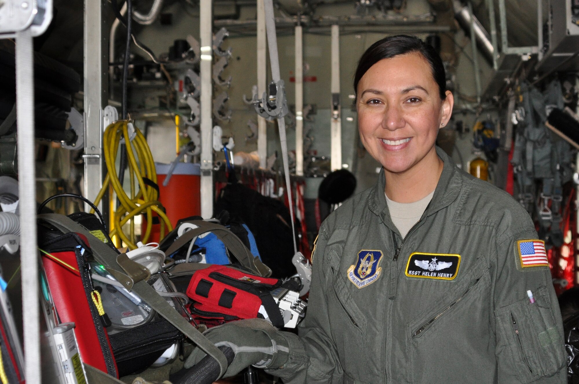 Master Sgt. Helen Henry, a flight medical technician with the 911th Aeromedical Evacuation Squadron, stands next to a prepped litter prior to departure in a C-130 Hercules at Pittsburgh International Airport Air Reserve Station, Pa.  Feb. 8, 2015. Henry, who works for The Department of Veteran’s Affairs as her civilian job said she stays motivated because she always has an opportunity to help someone. (U.S. Air Force photo by Staff Sgt. Brandy Grace)