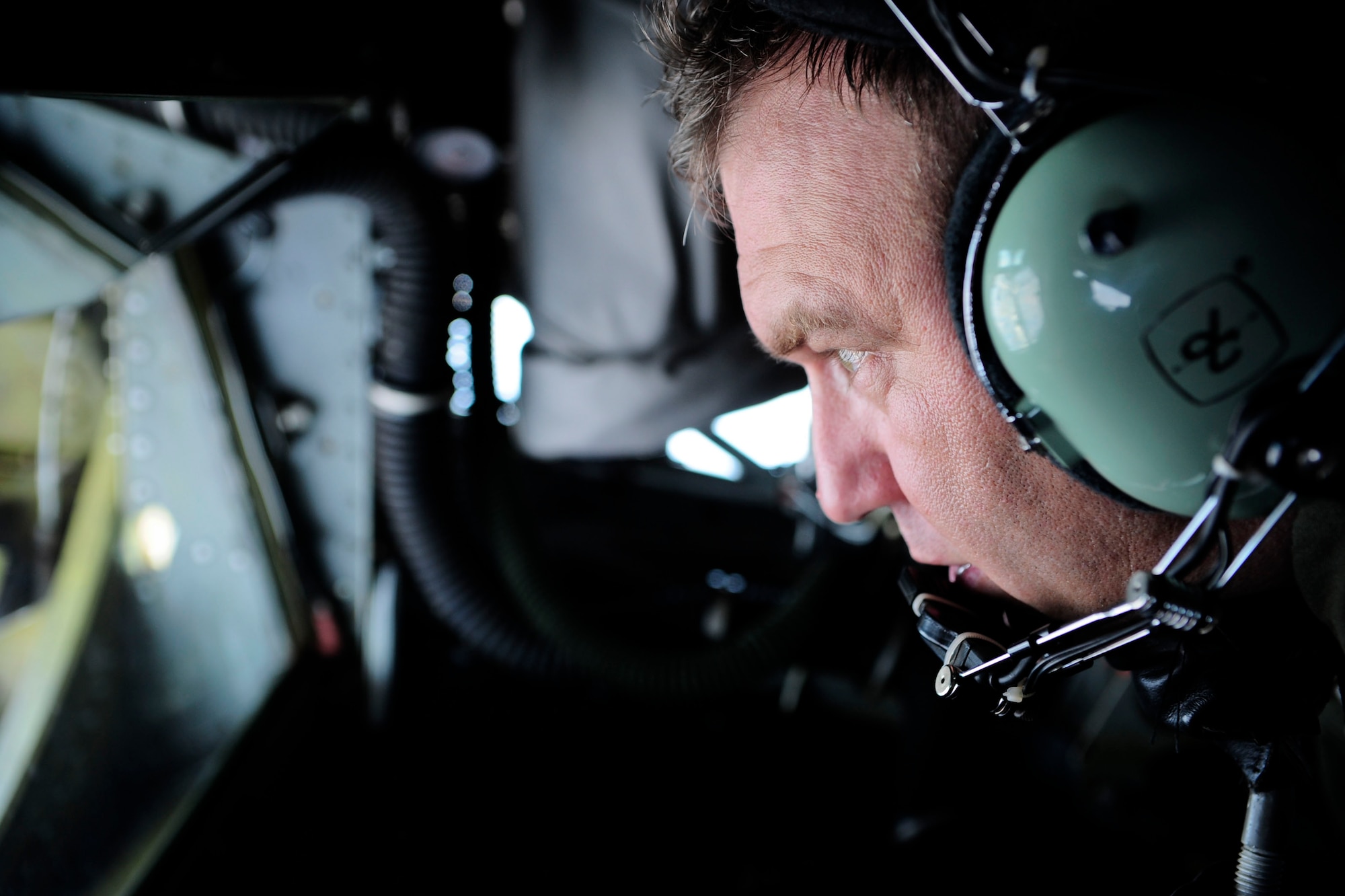 Senior Master Sgt. Walt Markwas, 91st Air Refueling Squadron boom operator, focuses on controlling the boom of a KC-135 Stratotanker in order to refuel a B-52 Stratofortress over Louisiana on Jan. 26, 2015. Markwas has had the opportunity to refuel a number of aircrafts all over the world during his career as a boom operator. (U.S. Air Force photo by Airman 1st Class Danielle Conde/Released)