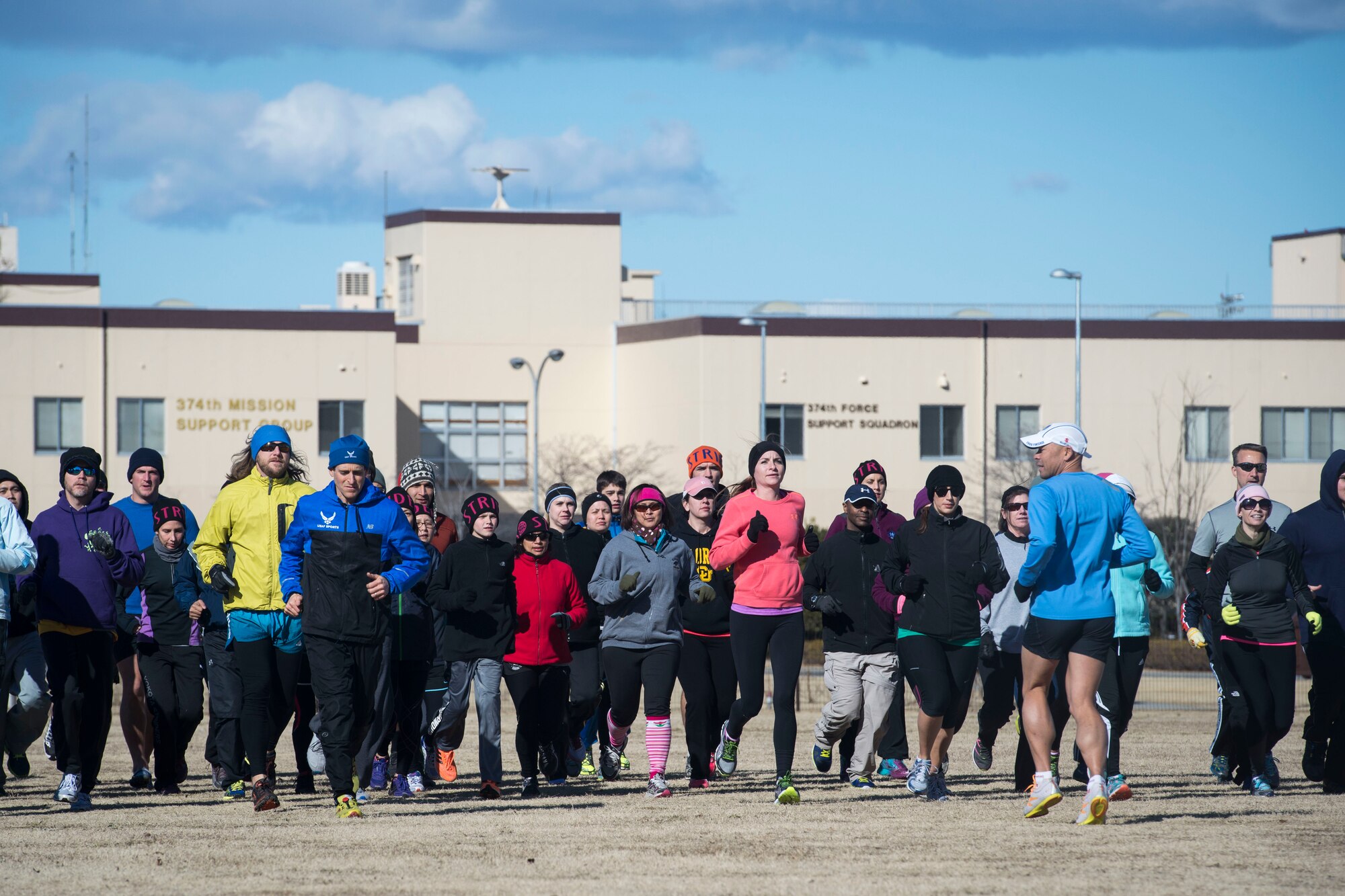 Ian Adamson leads a group of participants during an efficient running course at Yokota Air Base, Japan, Jan. 31, 2015. Adamson and Mark Cucuzzella led the course, teaching participants running techniques and giving them healthy lifestyle tips. (U.S. Air Force photo by Staff Sgt. Cody H. Ramirez/Released)
