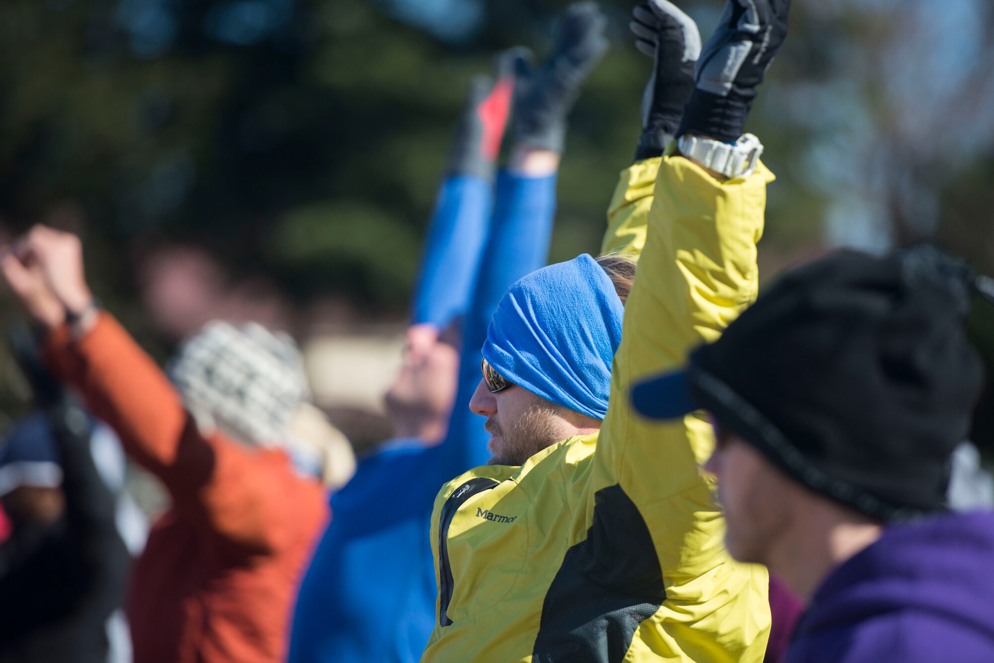 A participant stretches during an efficient running course at Yokota Air Base, Japan, Jan. 31, 2015. The course taught participants running techniques and health tips. (U.S Air Force photo by Staff Sgt. Cody H. Ramirez/Released)