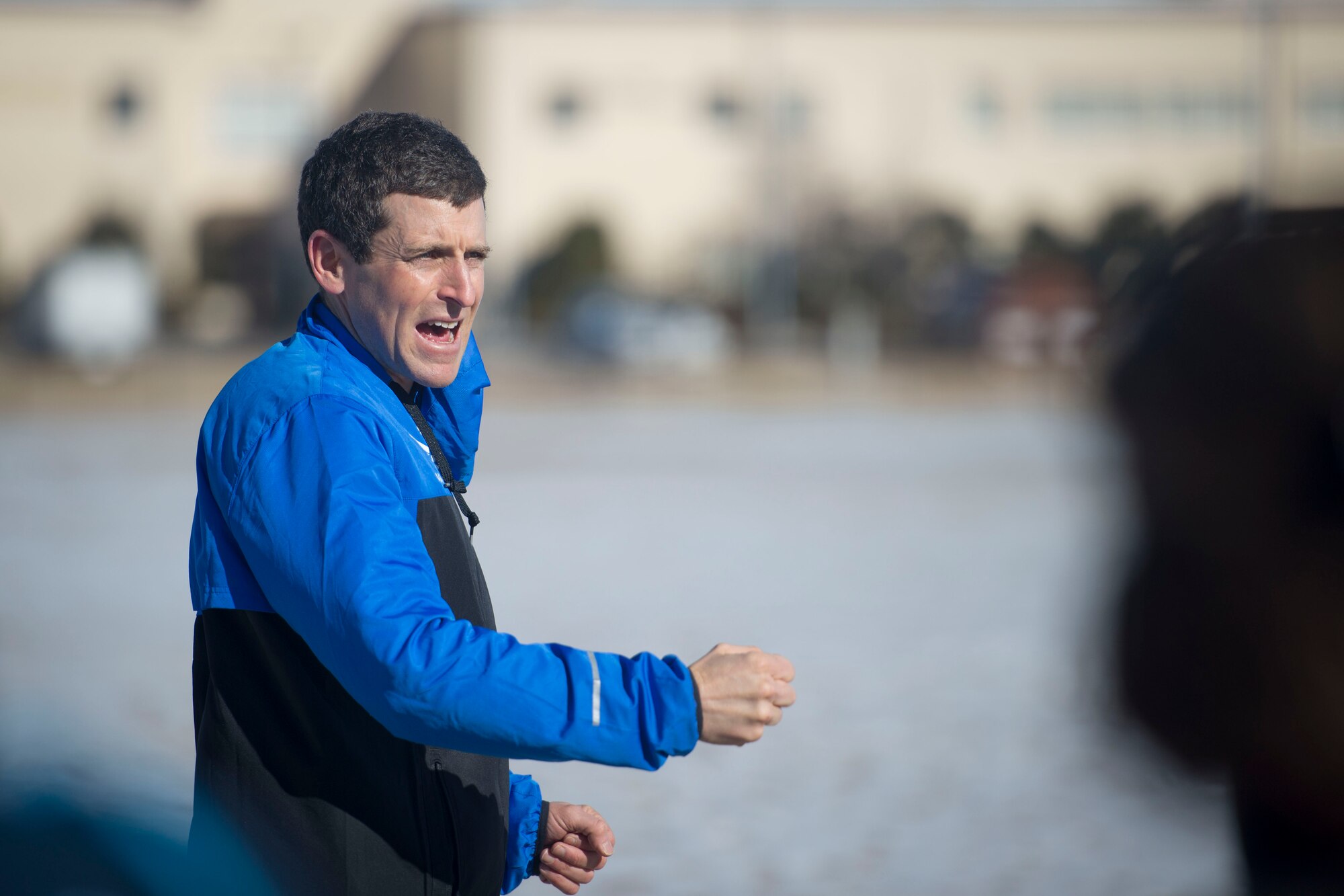 Mark Cucuzella teaches running techniques to participants during an efficient running course at Yokota Air Base, Japan, Jan. 31, 2015. The Health Promotion Flight hosted the course that offered running techniques and healthy lifestyle tips to the Yokota community. (U.S. Air Force photo by Staff Sgt. Cody H. Ramirez/Released)