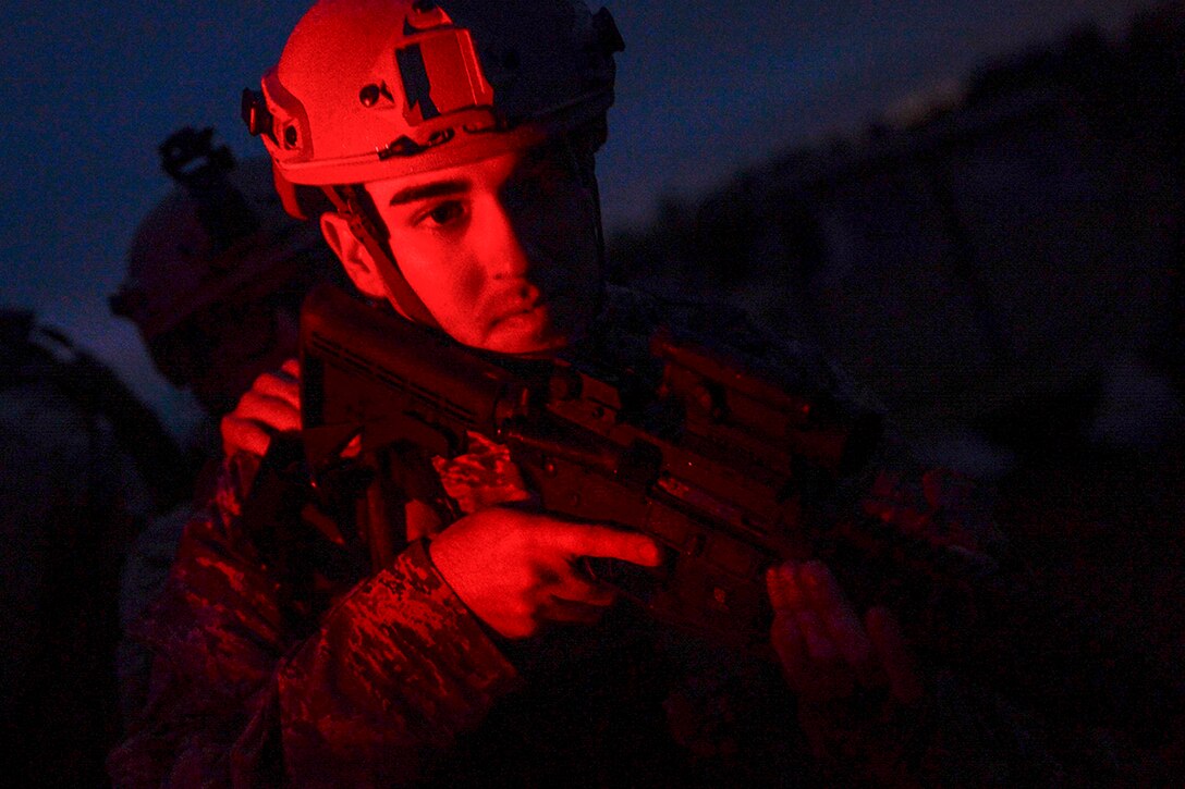 Air Force Senior Airman Jordan Castelan trains during exercise Scorpion Lens 2015 on North Auxiliary Air Field, located near the city of North, S.C., Feb. 9 , 2015. Castelan is a combat photojournalist assigned to the 3rd Combat Camera Squadron, Joint Base San Antonio-Lackland.