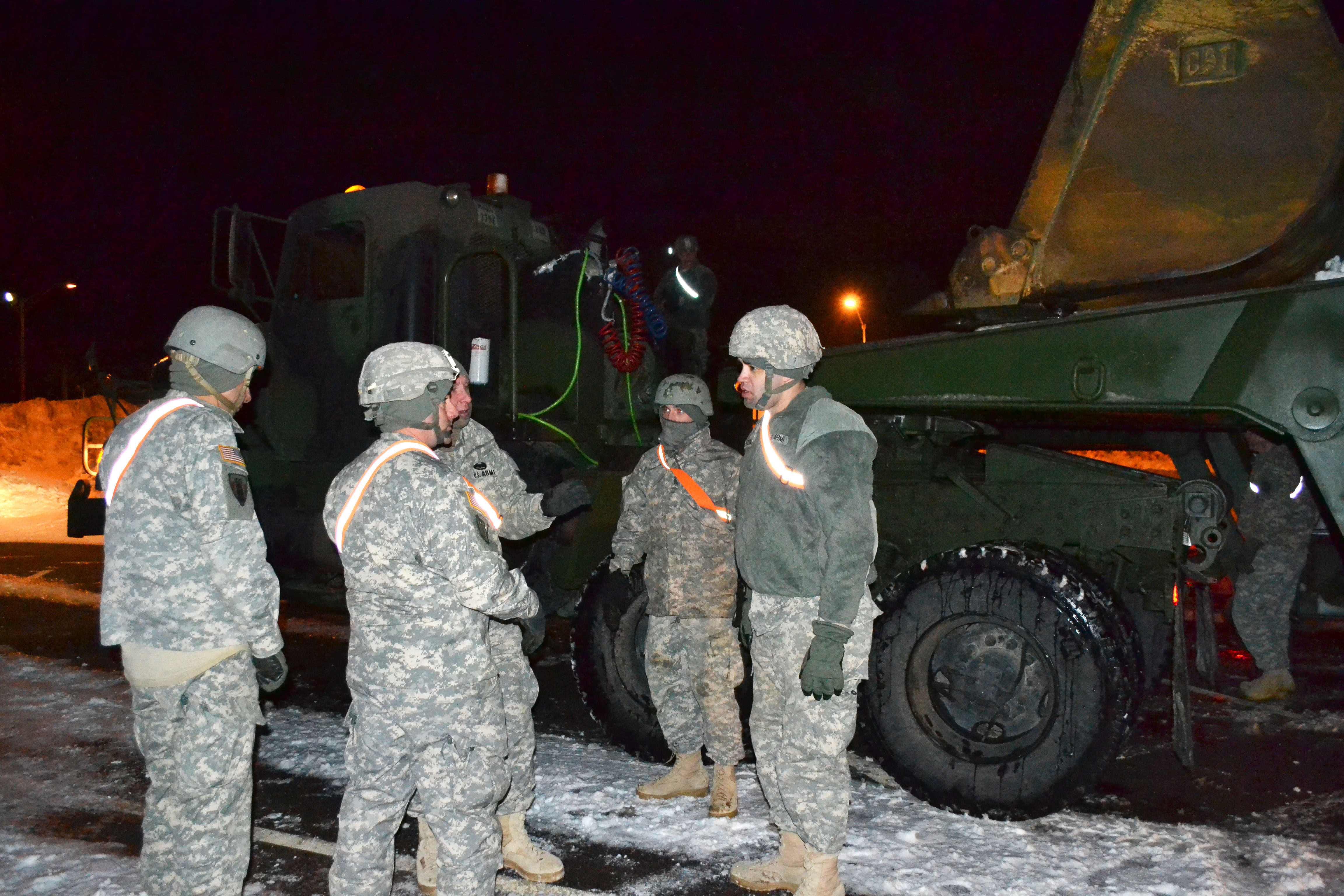 Soldiers recieve a mission brief before preparing their unit’s heavy ...