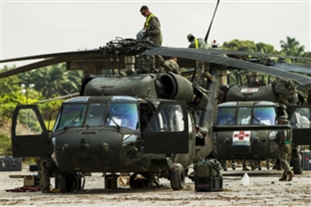 U.S. Army soldiers prepare Black Hawk helicopters for loading onto a ship to redeploy from Buchanan, Liberia, Feb. 10, 2015. The soldiers disassembled the helicopters at the 101st Sustainment Brigade’s Division Support Area near the Port of Buchanan.