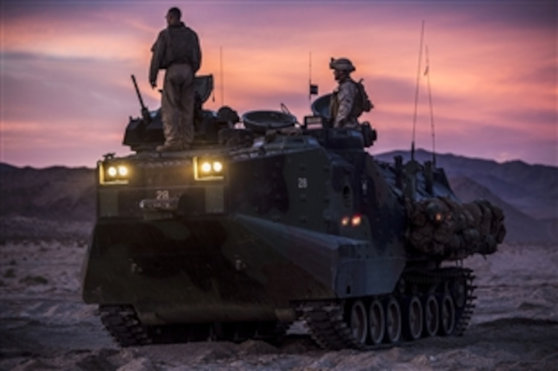 Marines prepare an assault amphibious vehicle during Integrated Training Exercise 2-15 on Marine Corps Air Ground Combat Center Twentynine Palms, Calif., Feb. 2, 2015. The Marines are assigned to Company D, 3rd Assault Amphibian Battalion, 1st Marine Division, I Marine Expeditionary Force.