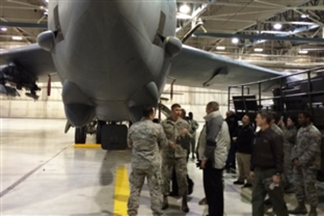 Deputy Defense Secretary Bob Work tours a B-52 weapons loading training hangar on Minot Air Force Base, N.D., Feb. 11, 2015. Work, who is chair of the Nuclear Deterrent Enterprise Review Group, is there to meet with nuclear enterprise airmen and tour the facilities.