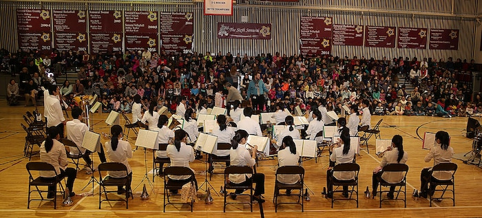 The Shinnanyo High School Brass Band performs the “Star-Spangled Banner” for the staff and students of Matthew C. Perry Elementary School aboard Marine Corps Air Station Iwakuni, Japan, Feb. 11, 2015. M. C. Perry hosted their 5th annual Japanese Cultural Exchange Program at the school’s gymnasium, which included traditional martial arts, a classical Japanese dance and musical performances.