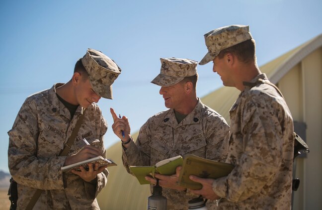 Gunnery Sgt. Kevin D. Pirtle (center) mentors his Marines after a meeting Jan. 8 at Marine Air Ground Combat Center Twentynine Palms during Integrated Training Exercise 2-15. Pirtle, a Somerville, Tennessee, native, is an infantry unit leader and the company gunnery sergeant for Headquarters and Service Company, 2nd Battalion, 3rd Marine Regiment,  3rd Marine Division, III Marine Expeditionary Force. 