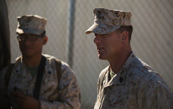 Gunnery Sgt. Kevin D. Pirtle (right) helps Marines organize equipment Feb. 8 at Marine Air Ground Combat Center Twentynine Palms before moving out to the field with Headquarters and Service Company during Integrated Training Exercise 2-15. The Combat Operations Center sends a group, “the forward”, to the field to operate closer to the events, simulating a real-world operation. Pirtle, a Somerville, Tennessee, native, is an infantry unit leader and company gunnery sergeant for Headquarters and Service Company, 2nd Battalion, 3rd Marine Regiment, 3rd Marine Division, III Marine Expeditionary Force.