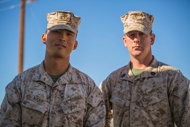 Gunnery Sgt. Kevin D. Pirtle (right) and Capt. Jim C. Wang pose for a photo Jan. 8 at Marine Air Ground Combat Center Twentynine Palms during Integrated Training Exercsie 2-15. Pirtle and Wang spend a lot of time working together in Headquarters and Service Company. Pirtle, a Somerville, Tennessee, native, is an infantry unit leader and the company gunnery sergeant, and Wang, a Fayetteville, North Carolina native, is an infantry officer and company commander, both with Headquarters and Service Company, 2nd Battalion, 3rd Marine Regiment, 3rd Marine Division, III Marine Expeditionary Force. 