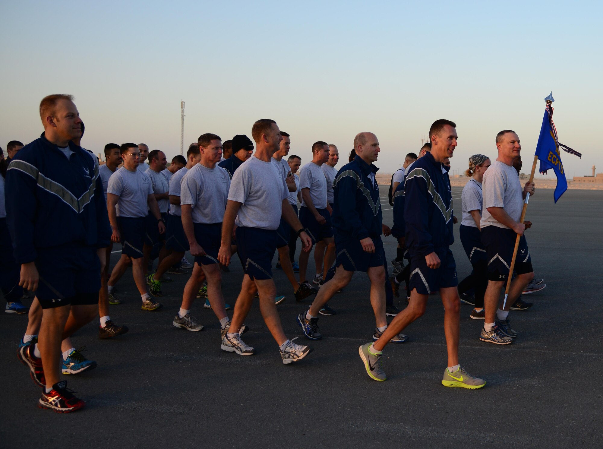 Airmen from the 379th Air Expeditionary  Wing  march in formation before a 1.5 mile run during Qatar National Sports Day, Feb. 10, 2015, at Al Udeid Air Base, Qatar. The run kicked off the rest of the morning’s events that included soccer and volleyball. (U.S. Air Force photo by Senior Airman Kia Atkins)