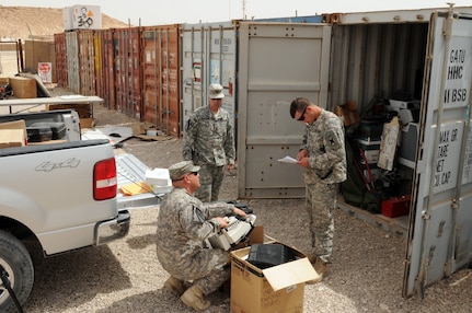 Soldiers with 3rd Battalion, 156th Infantry Regiment, 256th Infantry Brigade Combat Team of the Louisiana National Guard check serial numbers of items prepared for turn-in. The 256th IBCT has been chosen to turn in more than 17,000 pieces of theater provided equipment as part of the upcoming responsible drawdown of troops and equipment in Iraq.