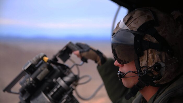 As part of the annual training exercise Scorpion Fire, Lance Cpl. Clinton Lehner, a crew chief with Marine Light Helicopter Squadron (HMLA) 369 “Gunfighters,” looks down range during close-air support maneuvers at the Chocolate Mountain Aerial Gunnery Range, Calif., Jan. 29. Marines with both tiltrotor and fixed-wing squadrons participate in this annual exercise, which provides a realistic environment for ground units in need of close air support.