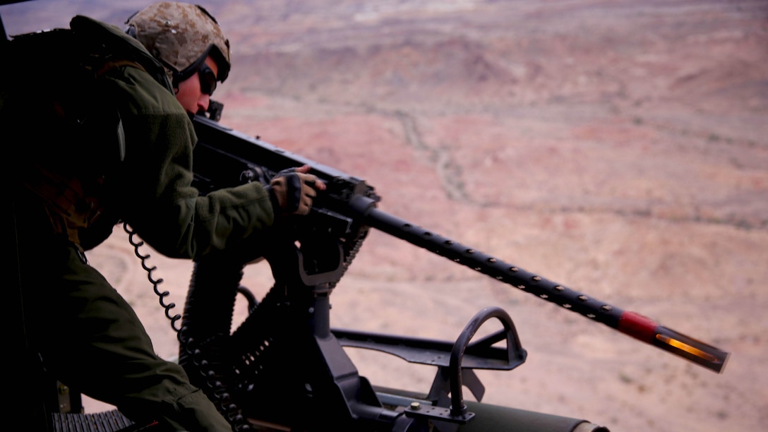 Sgt. Eric Hamer, a crew chief with Marine Light Helicopter Squadron (HMLA) 369 “Gunfighters” and a Murray, Iowa, native, fires a .50-caliber machine gun down range at the Chocolate Mountains Aerial Gunnery Range, Calif., Jan. 29. The Gunfighters conducted close air support missions as part of the annual training exercise, Scorpion Fire. 