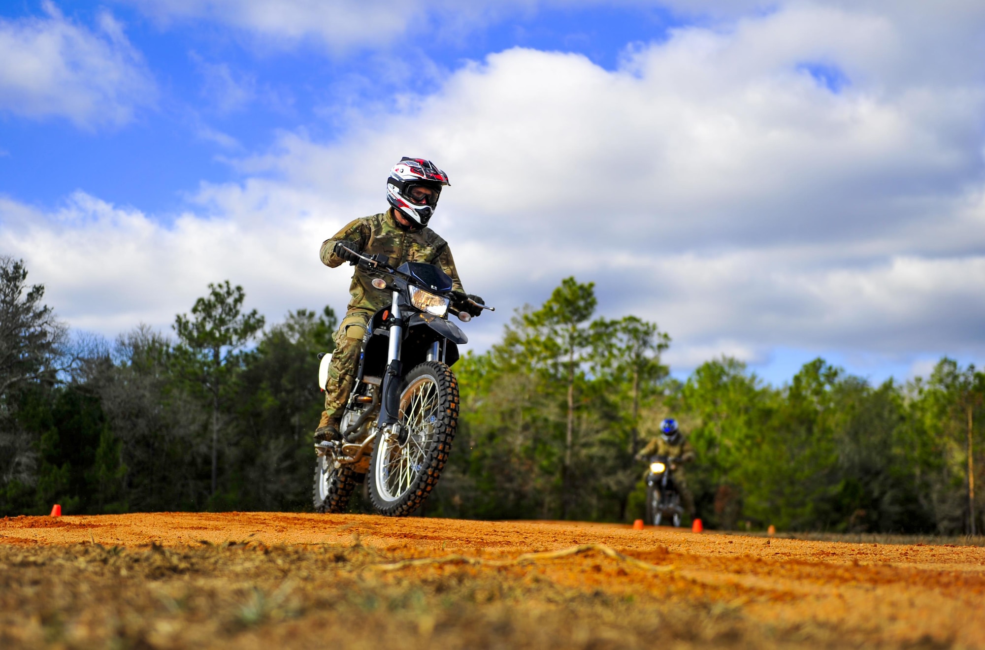 Members from the Special Tactics Training Squadron, 24th Special Operations Wing, Hurlburt Field, Fla., learn how to ride dirt bikes during an advanced tactical vehicle training at Eglin Range, Fla., Feb. 1-4, 2014. The STTS delivers advanced and special tactics skills to a wide variety of joint special operations career fields, including combat controllers and special tactics pararescuemen. (U.S. Air Force photo by Senior Airman Christopher Callaway/Released)