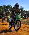 Members from the Special Tactics Training Squadron, 24th Special Operations Wing, Hurlburt Field, Fla., learn how to ride dirt bikes during an advanced tactical vehicle training at Eglin Range, Fla., Feb. 1-4, 2014. The STTS delivers advanced and special tactics skills to a wide variety of joint special operations career fields, including combat controllers and special tactics pararescuemen. (U.S. Air Force photo by Senior Airman Christopher Callaway/Released)
