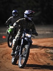 Members from the Special Tactics Training Squadron, 24th Special Operations Wing, Hurlburt Field, Fla., learn how to ride dirt bikes during an advanced tactical vehicle training at Eglin Range, Fla., Feb. 1-4, 2014. The STTS delivers advanced and special tactics skills to a wide variety of joint special operations career fields, including combat controllers and special tactics pararescuemen. (U.S. Air Force photo by Senior Airman Christopher Callaway/Released)
