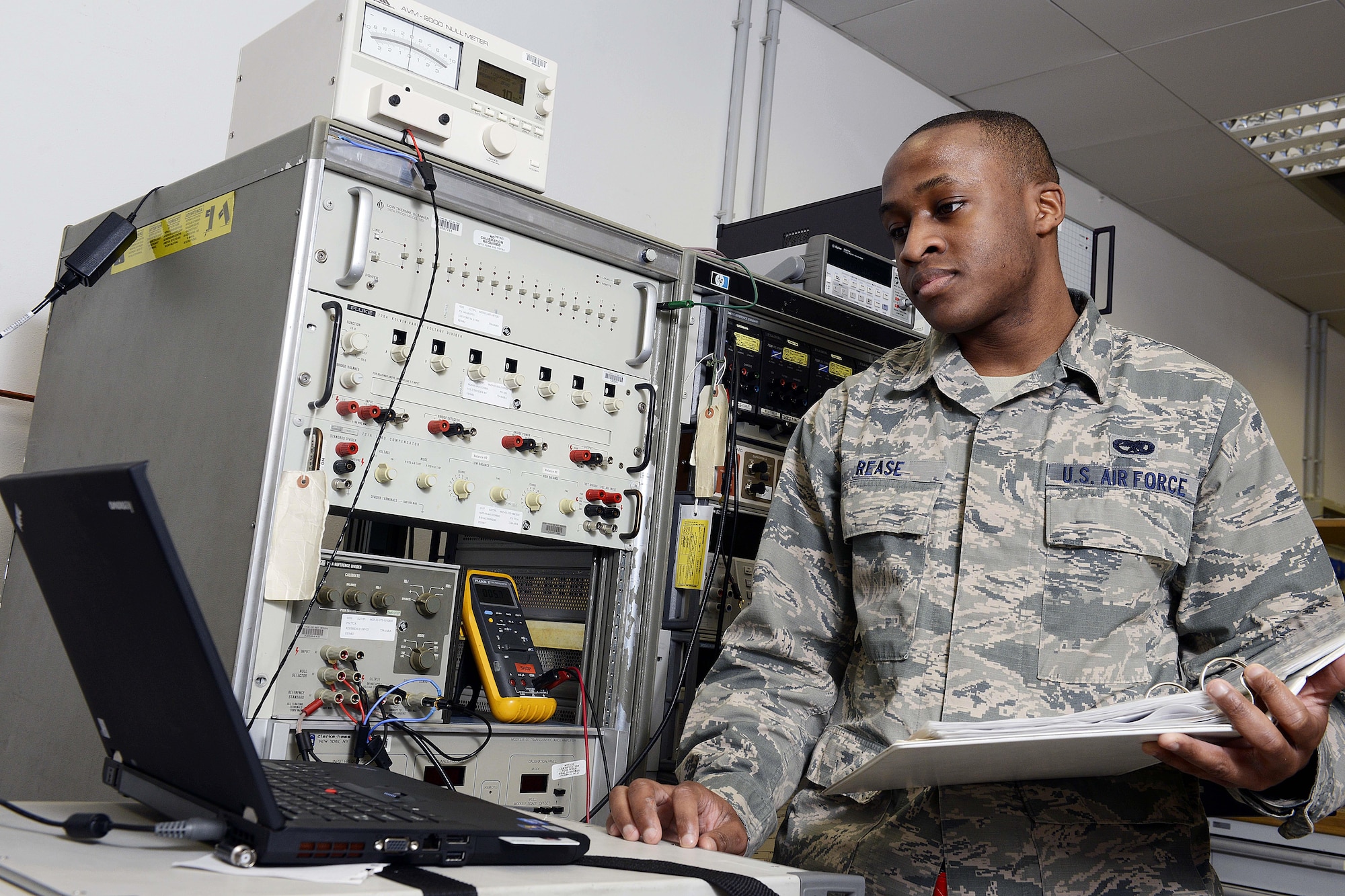 Senior Airman Julius Rease verifies DC voltage on a meter calibrator, Feb. 10, 2015, at Aviano Air Base, Italy. The precision measurement equipment laboratory (PMEL) Airmen support 5,200 different types of equipment on base for 84 different work centers.  Rease is a 31st Maintenance Squadron PMEL journeyman.  (U.S. Air Force photo/Airman 1st Class Ryan Conroy)