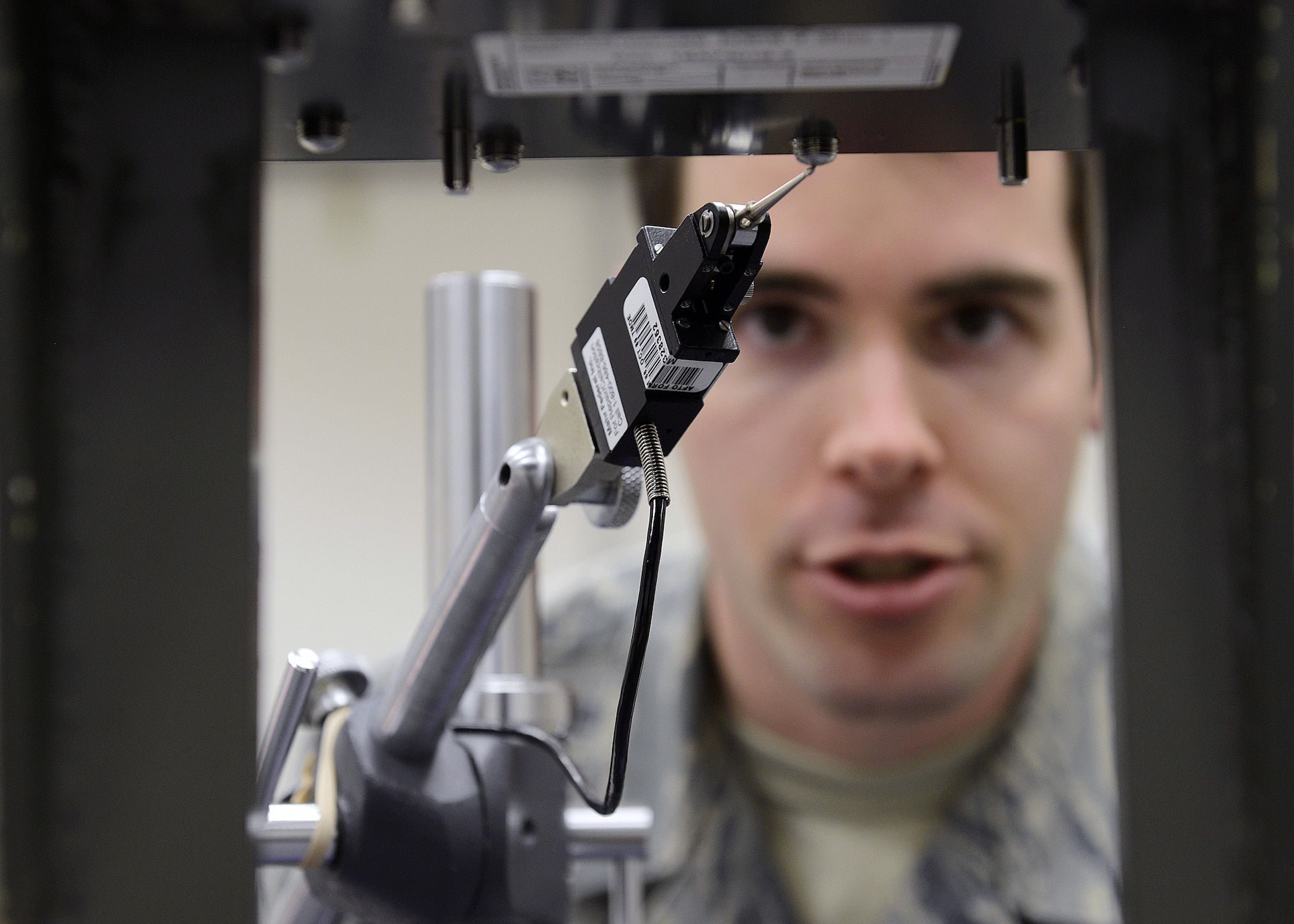 Senior Airman Evan Caso checks the setscrew height on a rate sensor unit boresight, Feb. 10, 2015, at Aviano Air Base, Italy. Precision measurement equipment laboratory (PMEL) technician’s calibrate and repair measurement and diagnostic equipment to provide customers with reliable, safe and accurate equipment that meets and exceeds expectations. Caso is a 31st Maintenance Squadron PMEL journeyman.  (U.S. Air Force photo/Airman 1st Class Ryan Conroy)